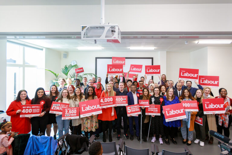 Keir Starmer with large group of campaigners holding 'vote Labour' signs