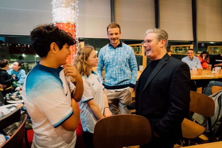 Keir Starmer in a bar with three England football fans